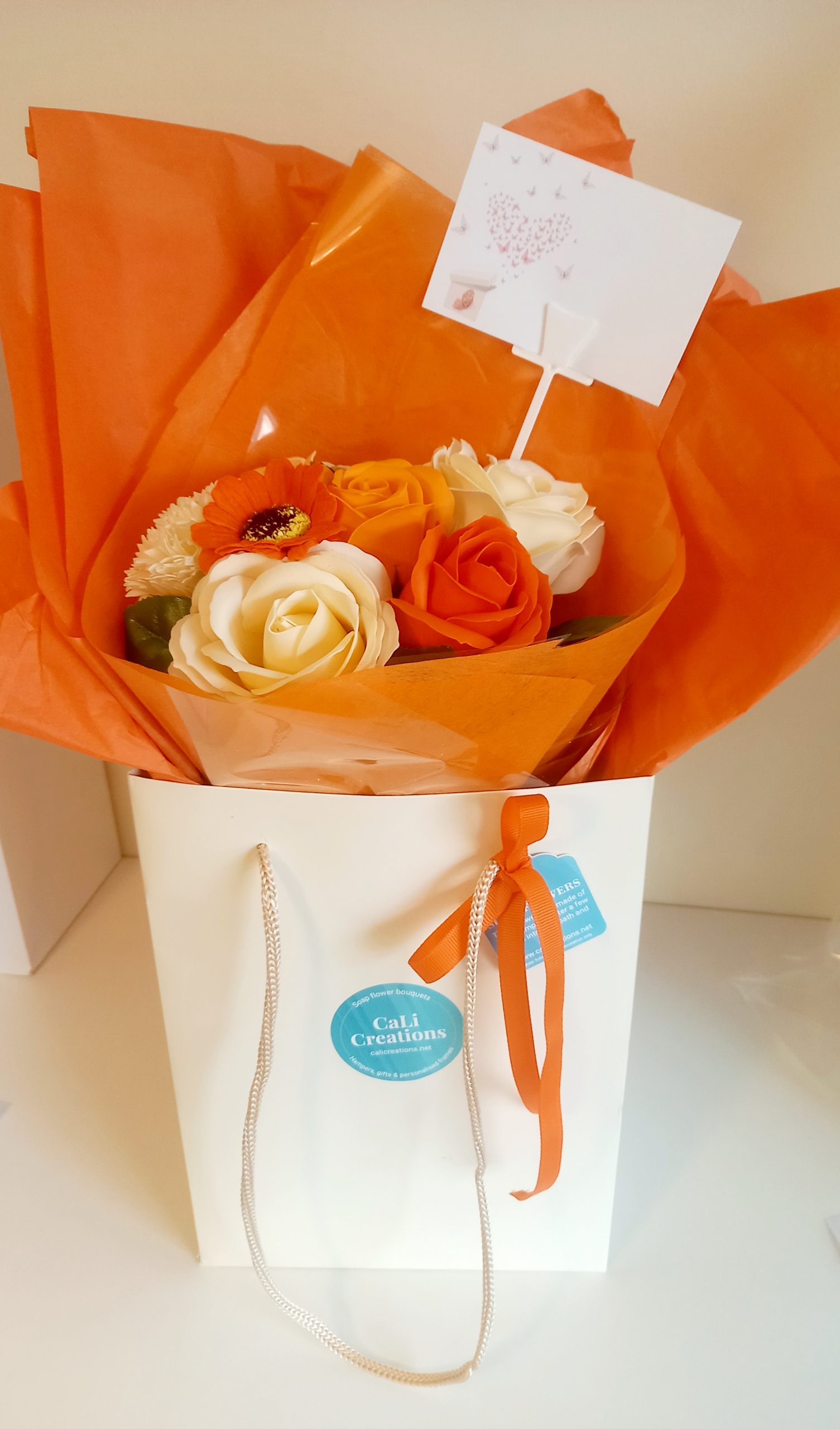 cream flower bag with orange flowers