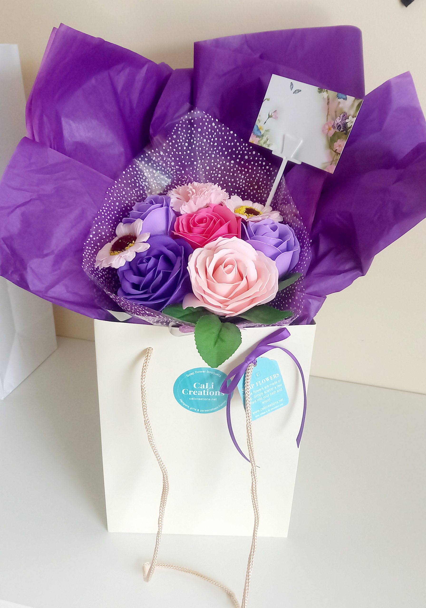 cream flower bag with pink and purple flowers